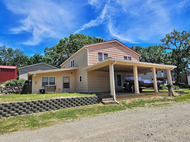 view of front of home with a carport