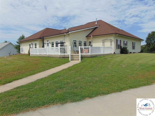 view of front of house with a front lawn and a wooden deck