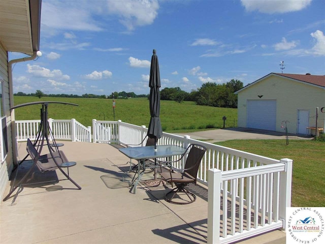 view of patio featuring an outdoor structure and a garage