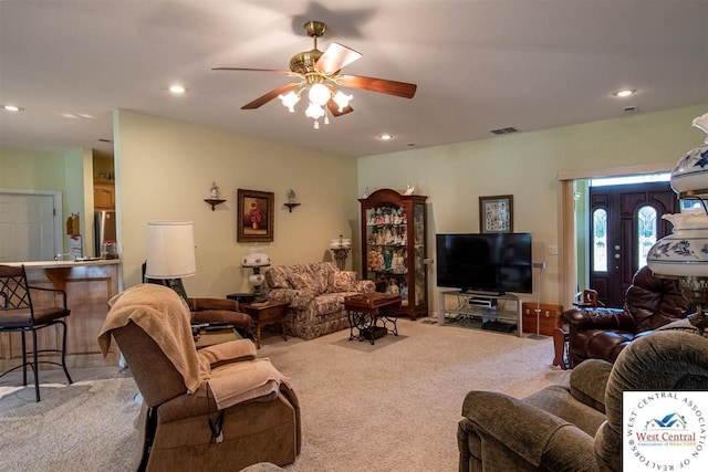 living room featuring recessed lighting, visible vents, light carpet, and ceiling fan