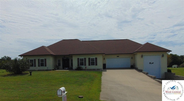 ranch-style home with a front yard, a garage, and driveway