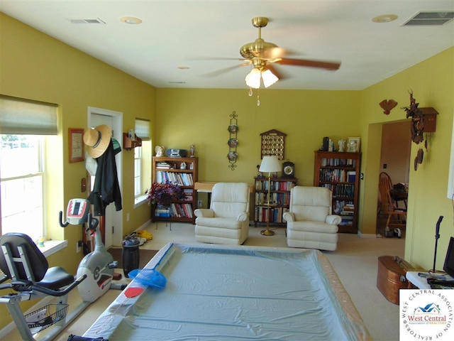 recreation room featuring visible vents, carpet floors, and ceiling fan