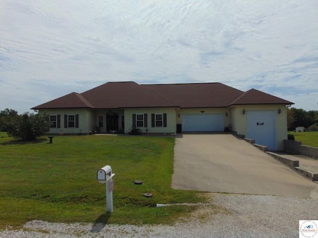 single story home featuring driveway, a front lawn, and a garage