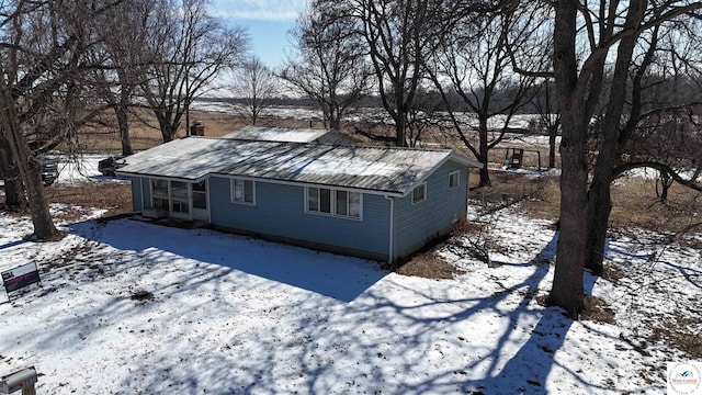 exterior space with metal roof