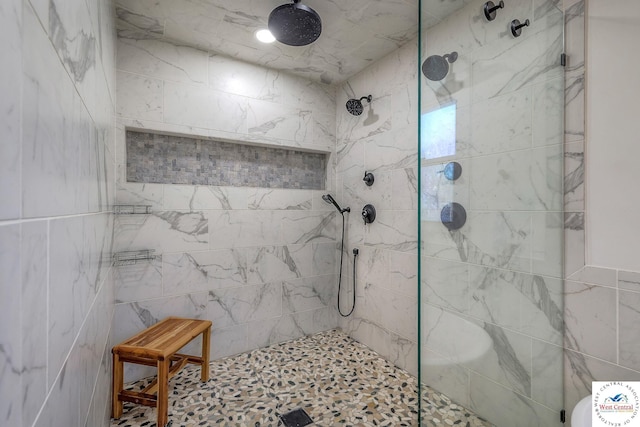 full bath featuring a tile shower