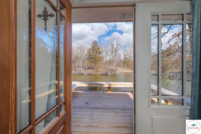 entryway featuring visible vents and a water view