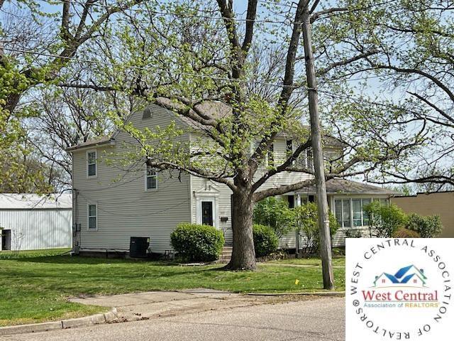 view of property exterior featuring a yard and central AC unit