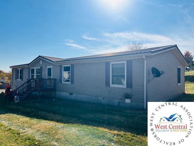 view of property exterior with crawl space and a yard