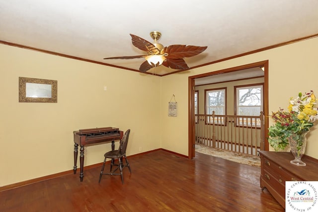 interior space with baseboards, wood finished floors, and ornamental molding