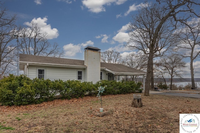 exterior space featuring a chimney