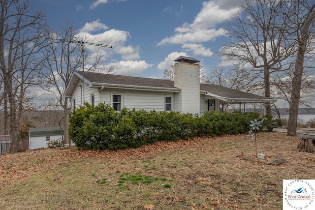 back of property featuring a chimney