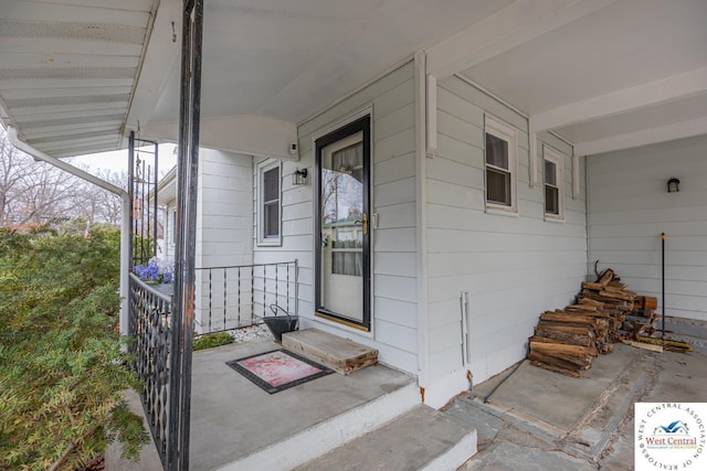 property entrance featuring covered porch