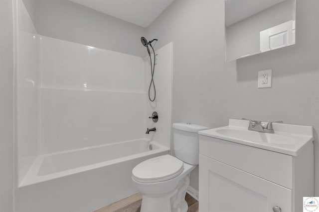 full bathroom with toilet, shower / bath combination, wood finished floors, and vanity