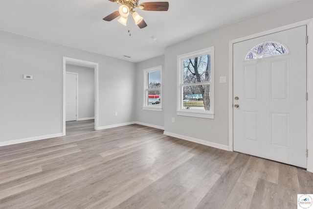 entrance foyer featuring light wood-style floors, ceiling fan, and baseboards