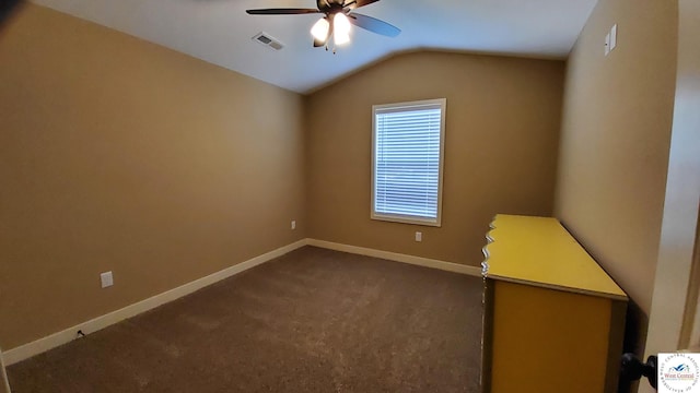 unfurnished bedroom with carpet floors, visible vents, a ceiling fan, vaulted ceiling, and baseboards