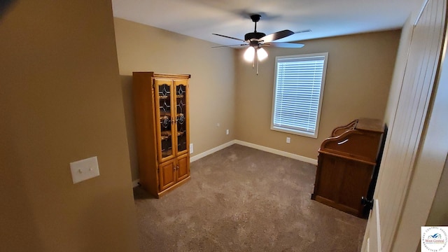 interior space with carpet floors, visible vents, ceiling fan, and baseboards