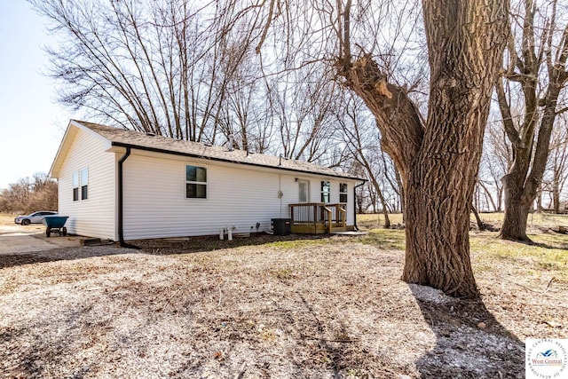 back of property featuring cooling unit