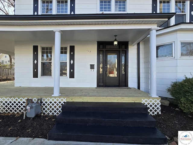 doorway to property featuring covered porch