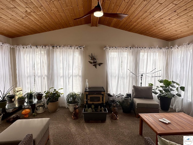 living area with carpet, wooden ceiling, ceiling fan, and lofted ceiling with beams