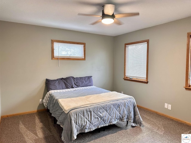 bedroom featuring carpet flooring, a ceiling fan, and baseboards