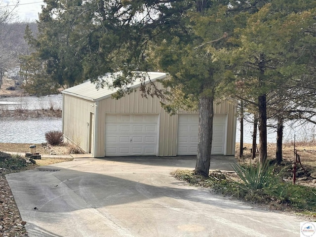 detached garage with a water view