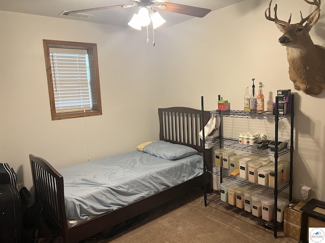 bedroom featuring a ceiling fan, carpet flooring, and visible vents