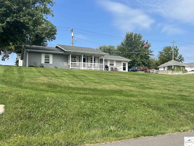 ranch-style home with a porch and a front yard