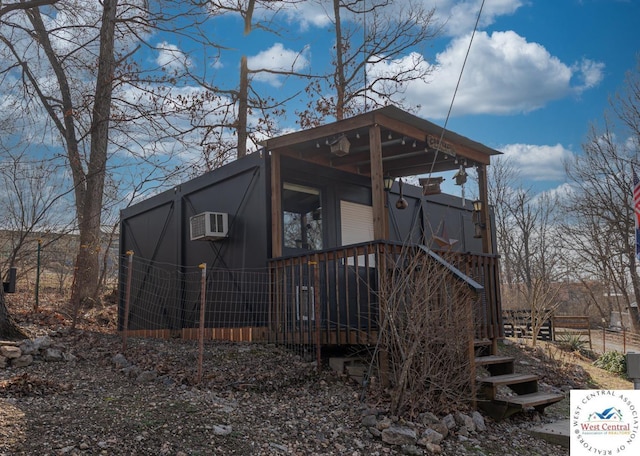 exterior space featuring a wall mounted air conditioner