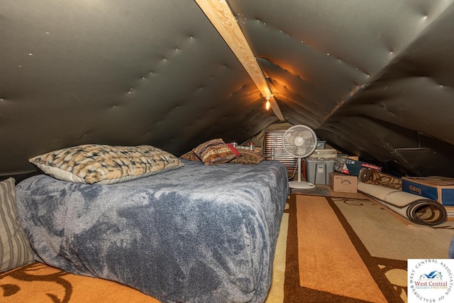 carpeted bedroom with vaulted ceiling