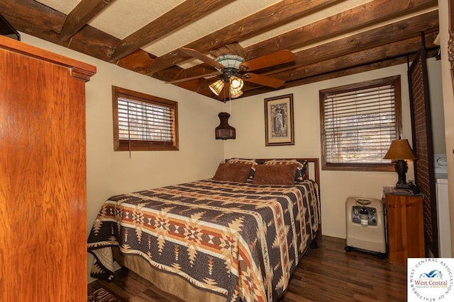 bedroom with beam ceiling and dark wood-type flooring