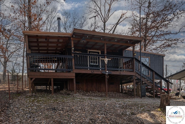 back of house with stairway and a wooden deck