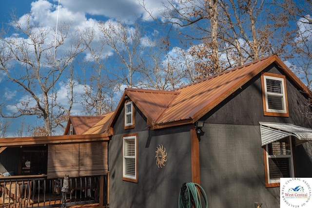 view of property exterior with metal roof