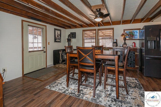 dining room with wood finished floors, a healthy amount of sunlight, and ceiling fan