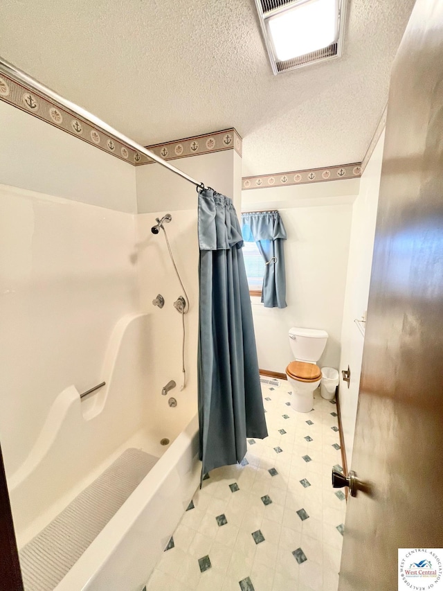 full bathroom with toilet, a textured ceiling, shower / bath combination with curtain, and visible vents