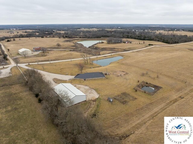 drone / aerial view with a rural view and a water view