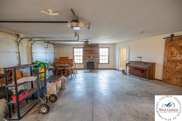 garage with baseboards and a garage door opener