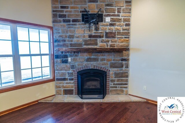 room details with baseboards and wood finished floors