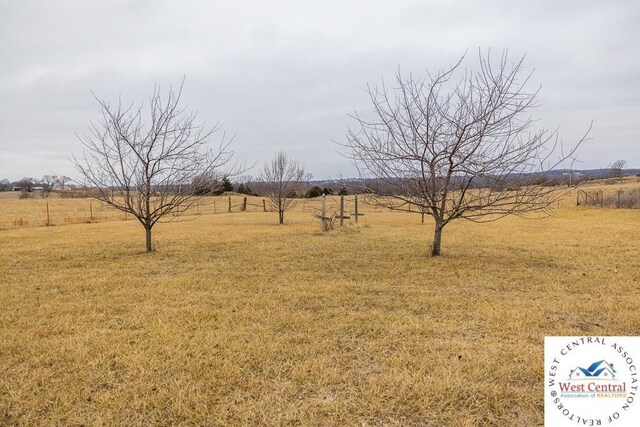 view of yard with a rural view