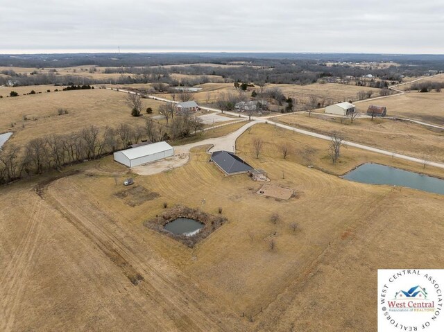 birds eye view of property featuring a rural view