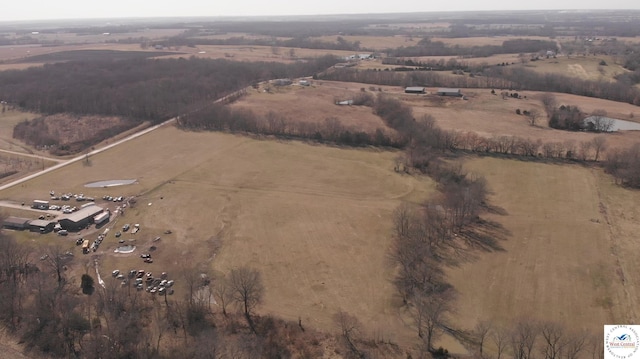 birds eye view of property with a rural view