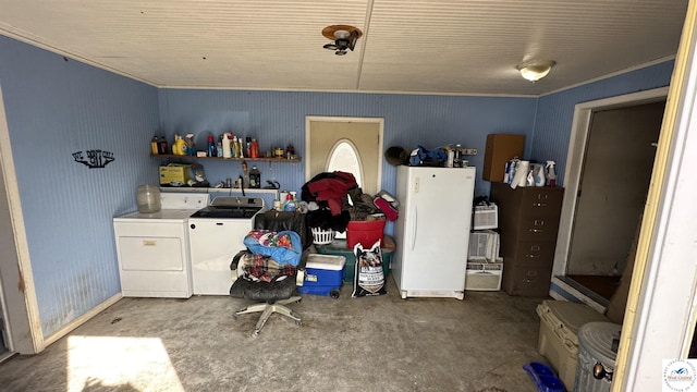 interior space with baseboards and separate washer and dryer