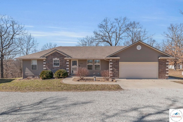 ranch-style house featuring a garage, concrete driveway, and roof with shingles