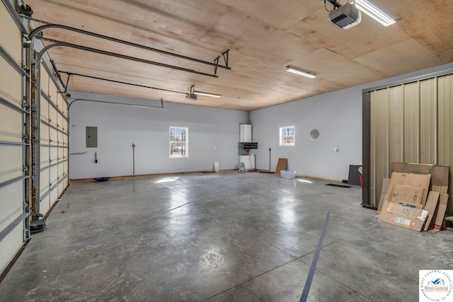 garage featuring a garage door opener and electric panel