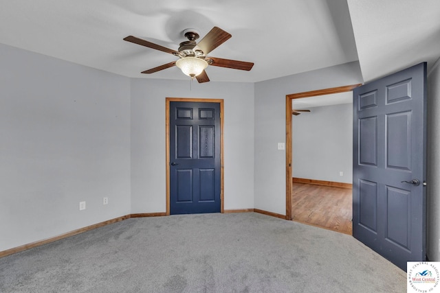 unfurnished bedroom with carpet, baseboards, and ceiling fan