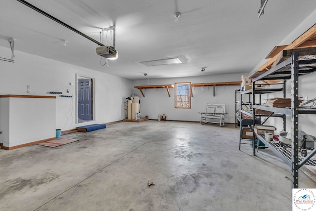 garage featuring a garage door opener, gas water heater, and baseboards