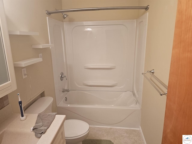 bathroom featuring shower / tub combination and toilet