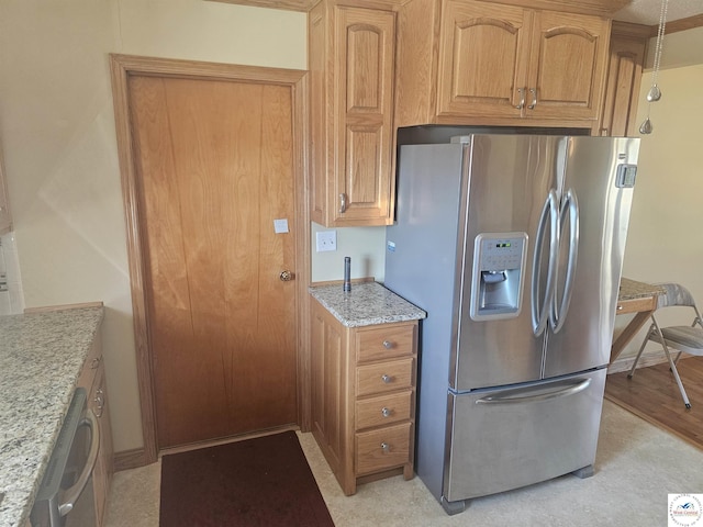 kitchen with light wood finished floors, brown cabinetry, stainless steel fridge with ice dispenser, baseboards, and light stone countertops