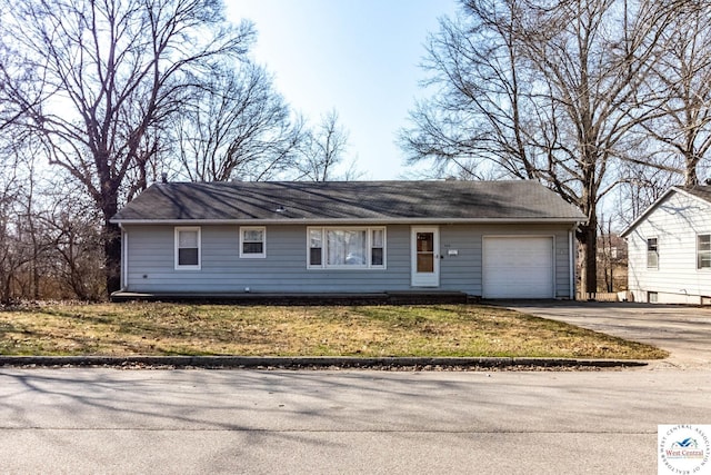 ranch-style home with driveway and a garage