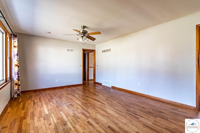 unfurnished room featuring visible vents and light wood finished floors