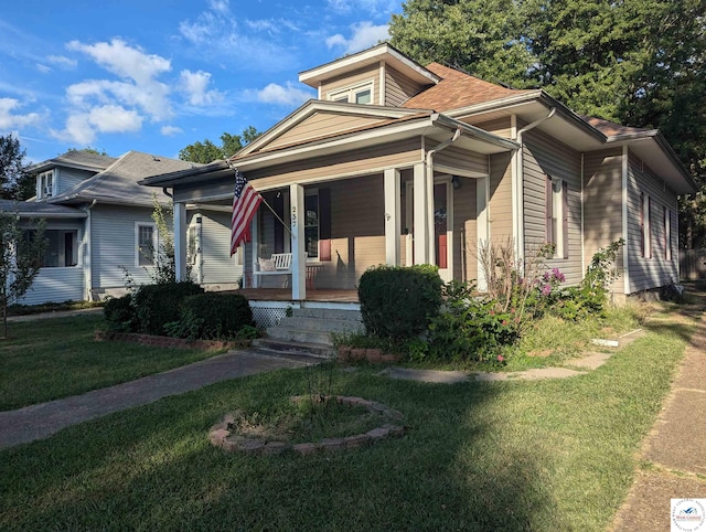 bungalow-style house with a porch and a front yard